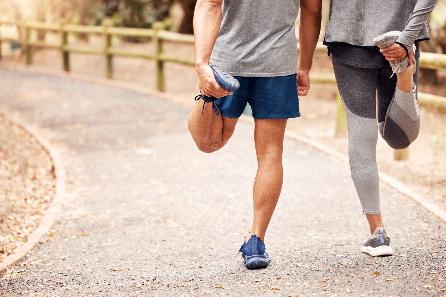 Buy stock photo Couple, legs and stretching on road for fitness, exercise and  wellness with walk at the park in morning together. Man, woman and warm up with foot for start of training, workout and health outdoor