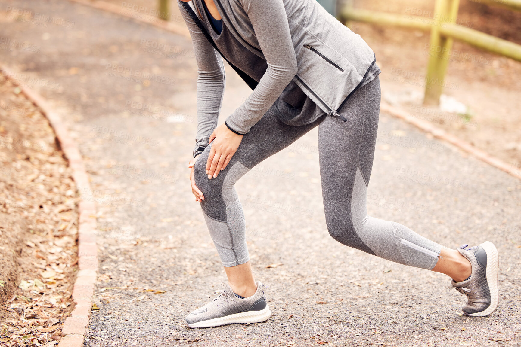 Buy stock photo Hands, knee pain and runner in park, person or injury in training for fitness, health and workout in nature. Athlete, joint or accident with burnout on countryside for exercise, wellness or emergency