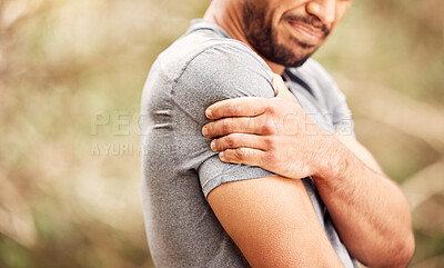 Buy stock photo Fitness, closeup and man with shoulder pain, nature and sports with exercise, muscle tension or health issue. Zoom, male person or athlete outdoor, medical problem or emergency with workout or injury