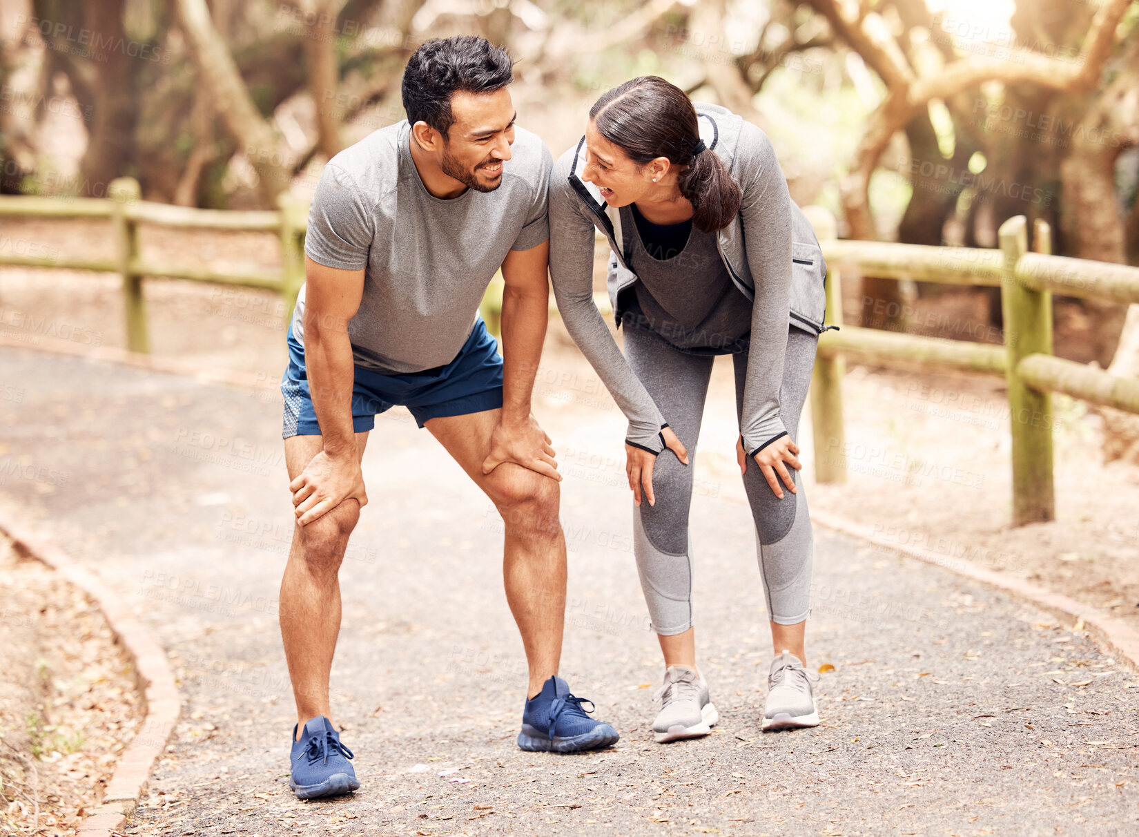 Buy stock photo Couple, tired and fitness of run, outdoor and exhausted in nature of countryside, road or path. Pain, muscle and legs of man, woman and together for exercise, training or people in Texas and workout