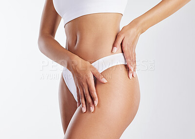 Buy stock photo Cropped shot of a fit young woman showing off her thighs