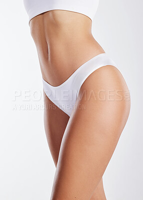 Buy stock photo Cropped shot of a fit young woman posing in her panty