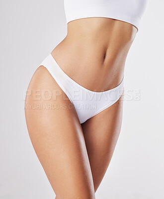 Buy stock photo Cropped shot of a fit young woman posing in her panty
