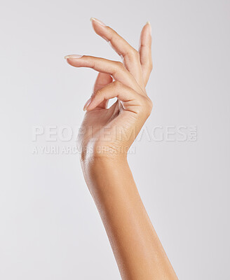 Buy stock photo Cropped shot of an unrecognizable woman's hand against a studio background