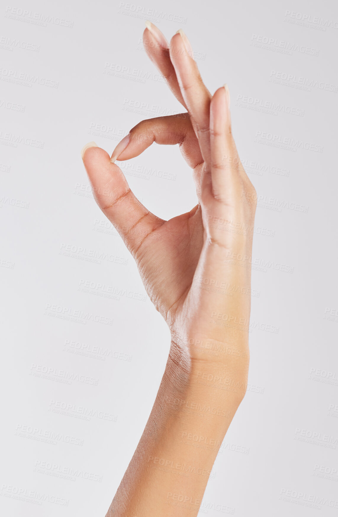 Buy stock photo Cropped shot of an unrecognizable woman showing the ok sign