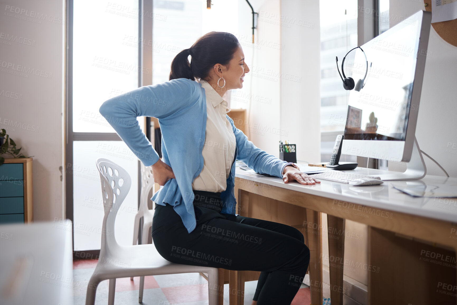 Buy stock photo Office, tired and woman in customer service with back pain stress or muscle injury in call center. Uncomfortable, body or exhausted consultant for anatomy with spine inflammation, crisis or scoliosis