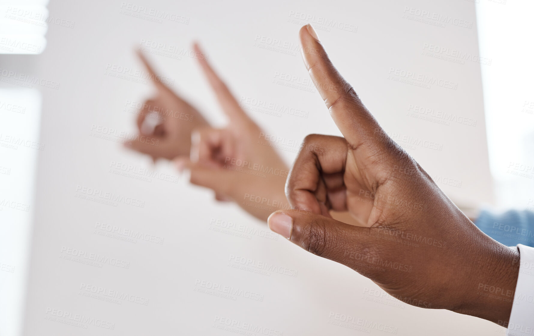 Buy stock photo Shot of a group of unrecognisable businesspeople pointing during a meeting in a modern office