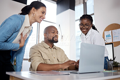 Buy stock photo Shot of a group of businesspeople using a laptop in a modern office