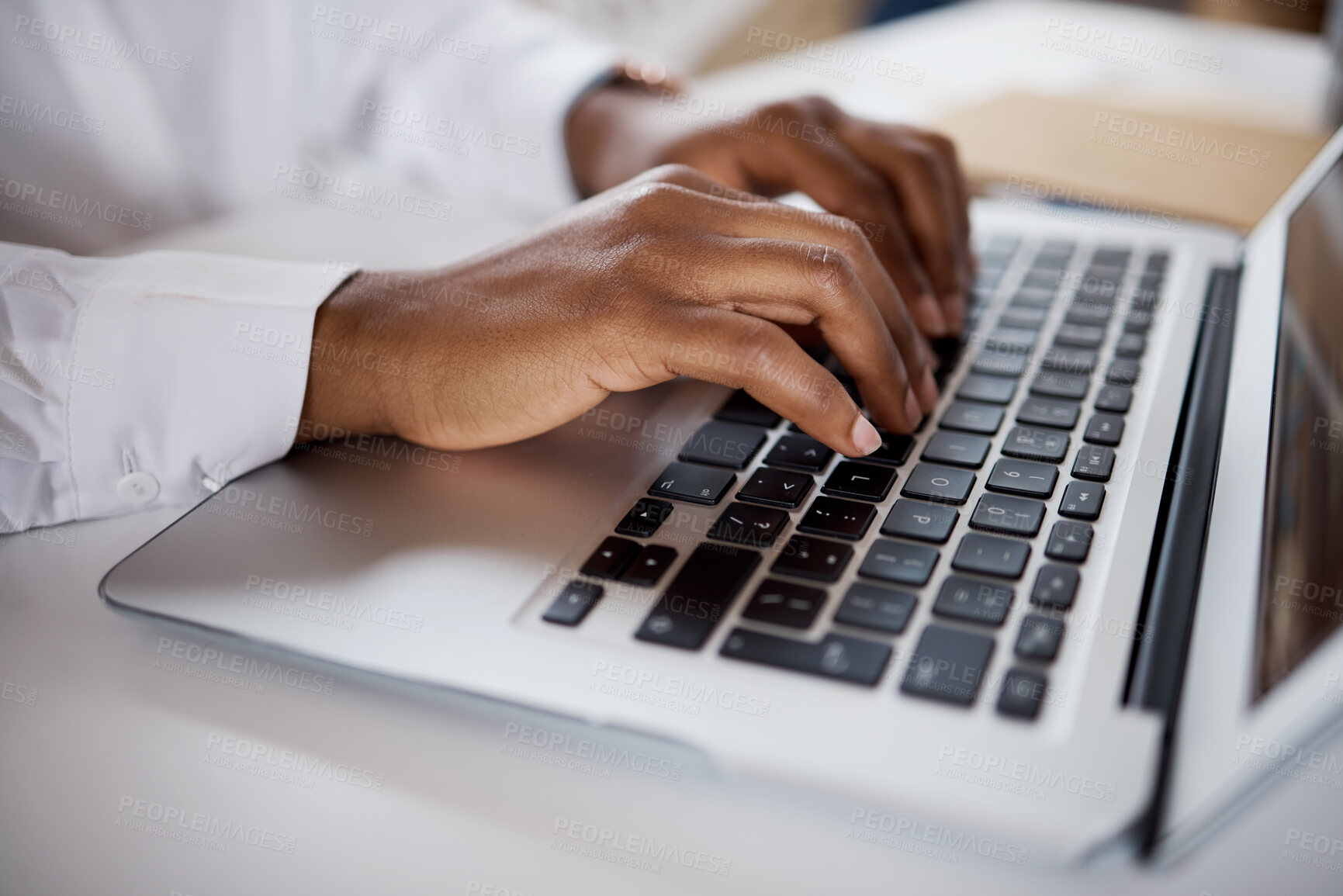 Buy stock photo Shot of an unrecognisable businesswoman using a laptop in a modern office