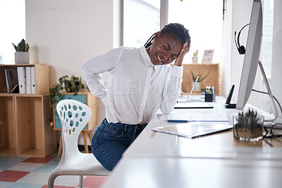 Buy stock photo Black woman, back pain and worker headache in office, stress and professional fibromyalgia by desk. Female person, exhausted and accident injury in workplace, spine inflammation and migraine tension