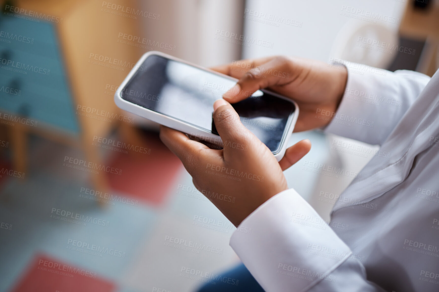 Buy stock photo Shot of an unrecognisable businesswoman using a smartphone in a modern office