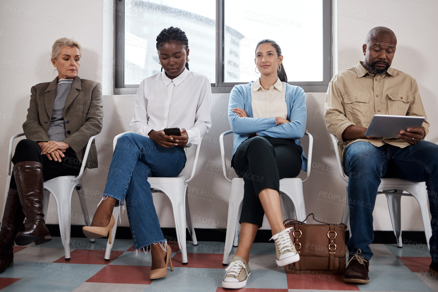 Buy stock photo Shot of a group of businesspeople waiting in a line in a modern office