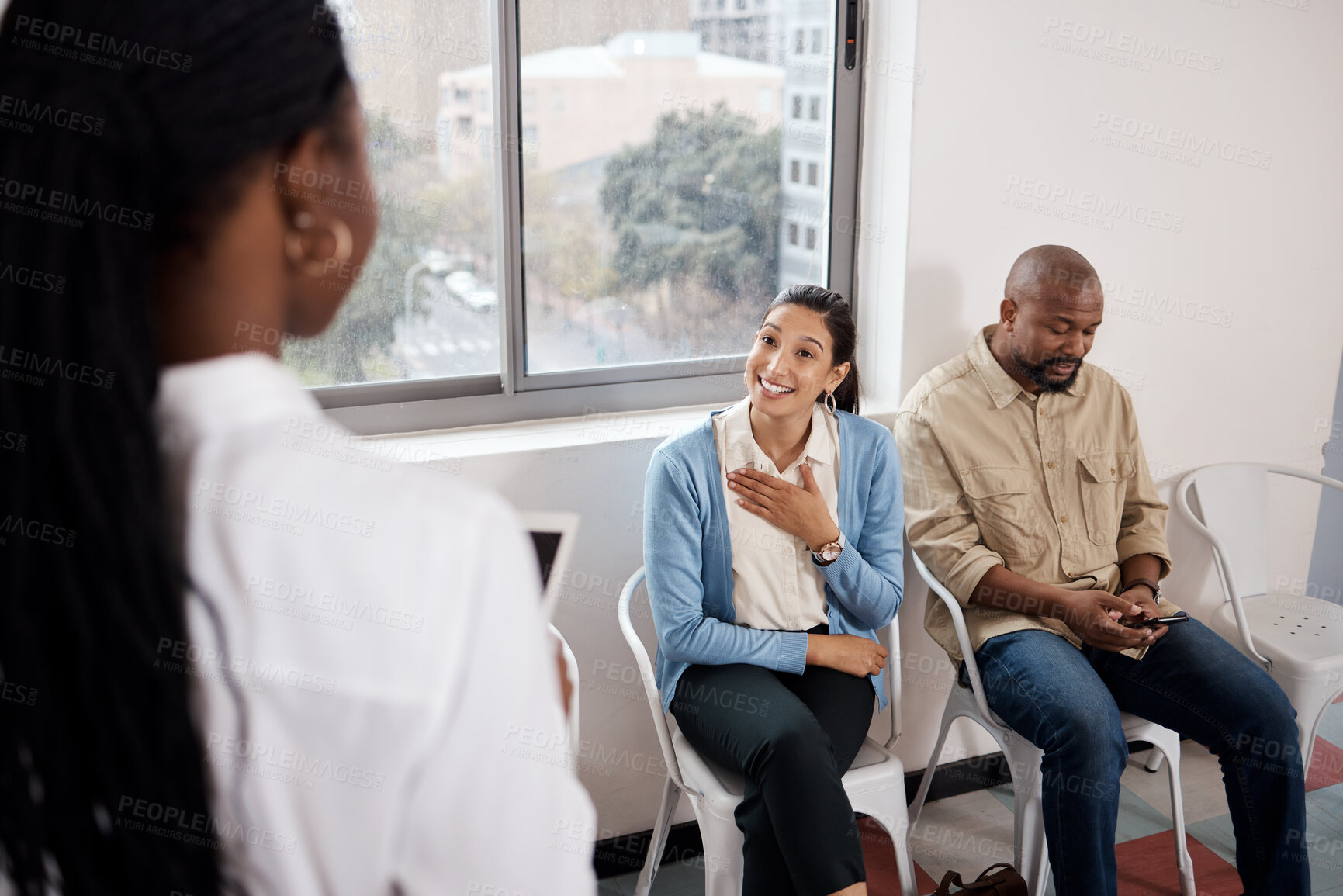 Buy stock photo Shot of a young businesswoman having a conversation while waiting in a line in a modern office