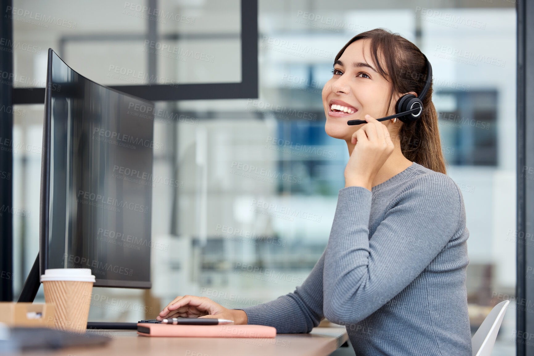 Buy stock photo Shot of a young businesswoman working on a computer in an office