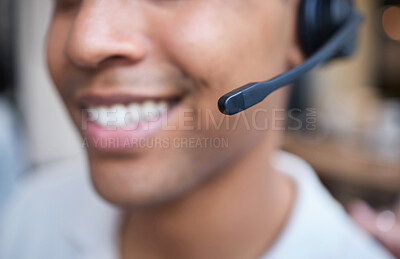 Buy stock photo Shot of an unrecognizable businessman sitting alone in his office and wearing a headset