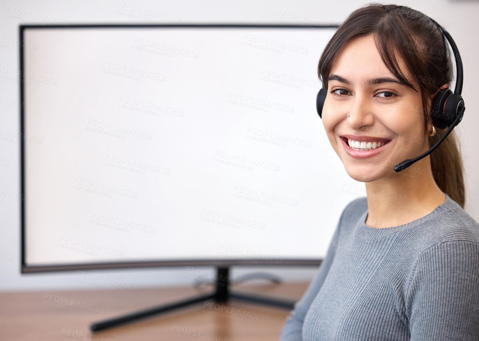 Buy stock photo Shot of a young businesswoman working on a computer in an office