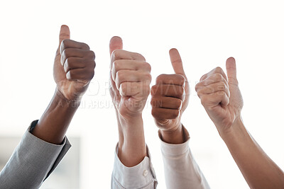 Buy stock photo Cropped shot of a group of unrecognizable businesspeople giving thumbs up while standing in their office