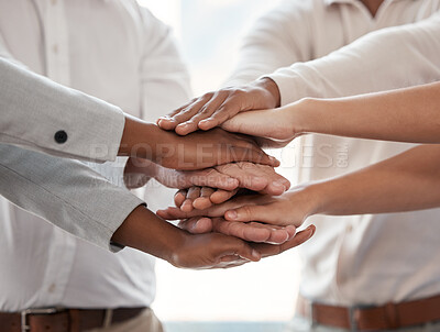 Buy stock photo Cropped shot of a group of unrecognizable businesspeople standing with their hands in a huddle