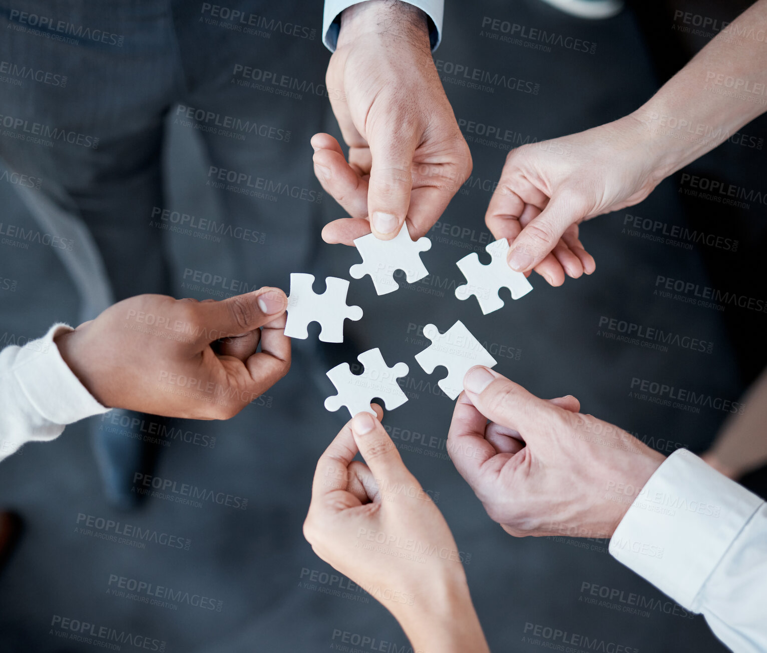 Buy stock photo Hands, puzzle and above for teamwork in office with business people, support and connection for solution. Group, scrum and jigsaw with synergy, strategy and problem solving with link in workplace