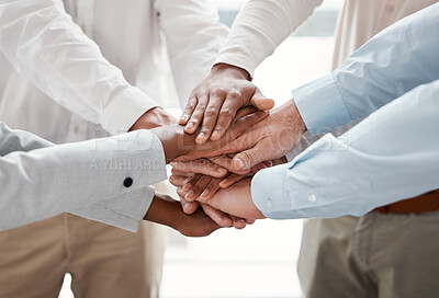 Buy stock photo Cropped shot of a group of unrecognizable businesspeople standing with their hands in a huddle