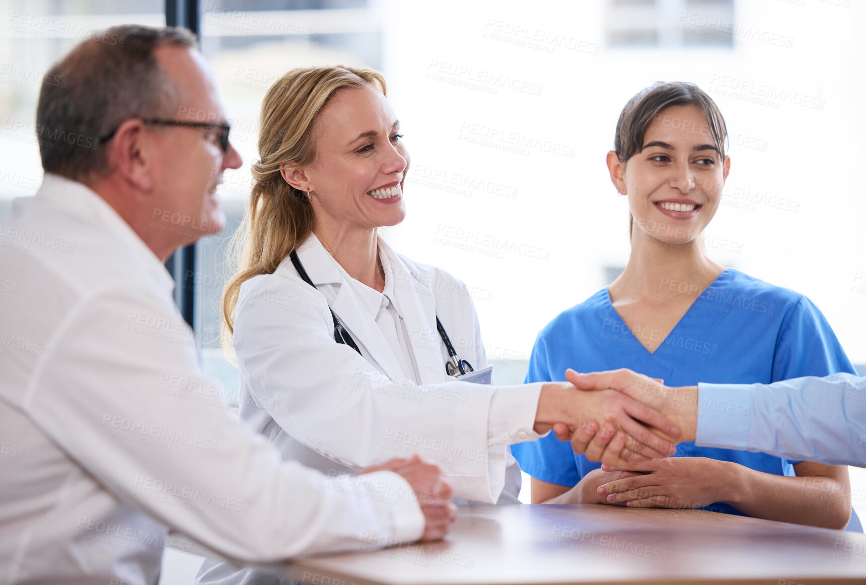 Buy stock photo Business, meeting and doctors in office handshake, agreement or investment in healthcare. Health insurance, men and women shaking hands with medical consultant for hospital funding, deal or support