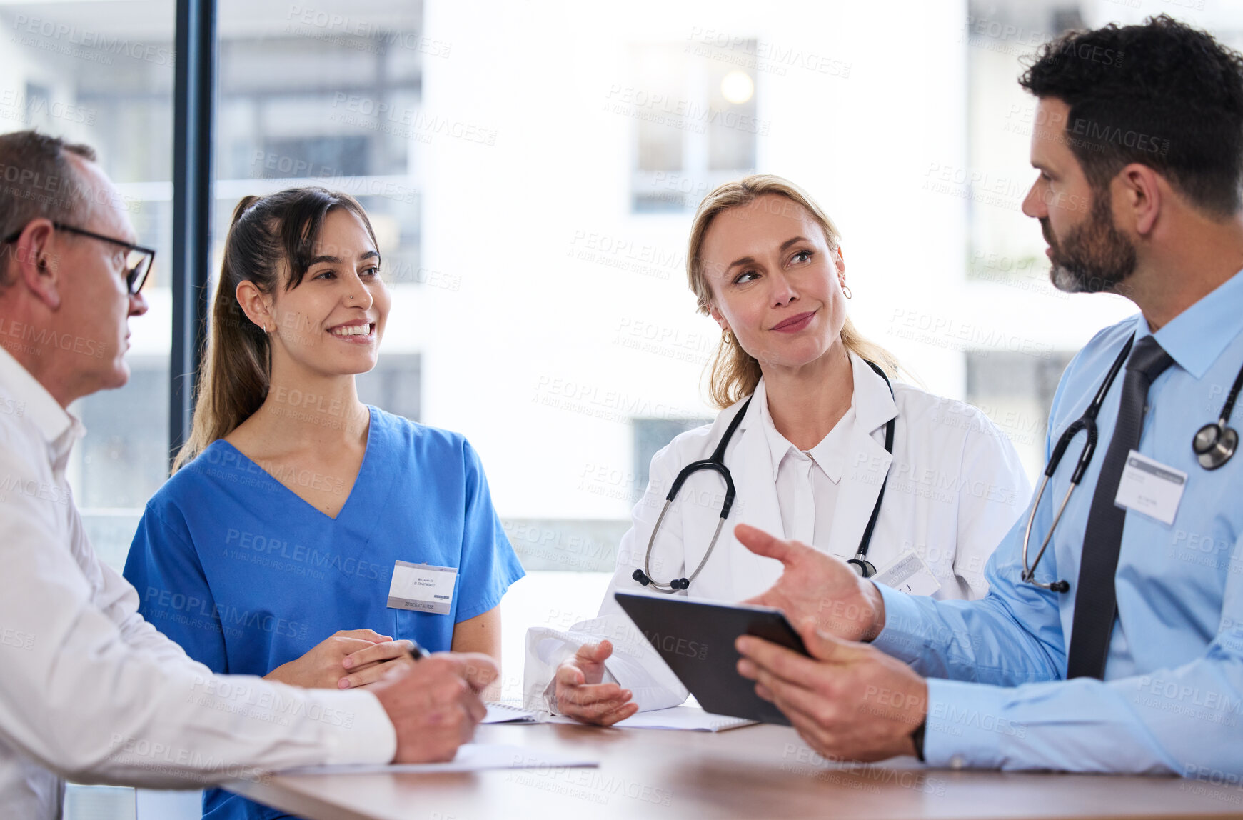 Buy stock photo Teamwork, tablet and doctors in meeting in hospital for medical results, consulting or online research. Healthcare, clinic and men and women on digital tech for wellness, telehealth or patient report