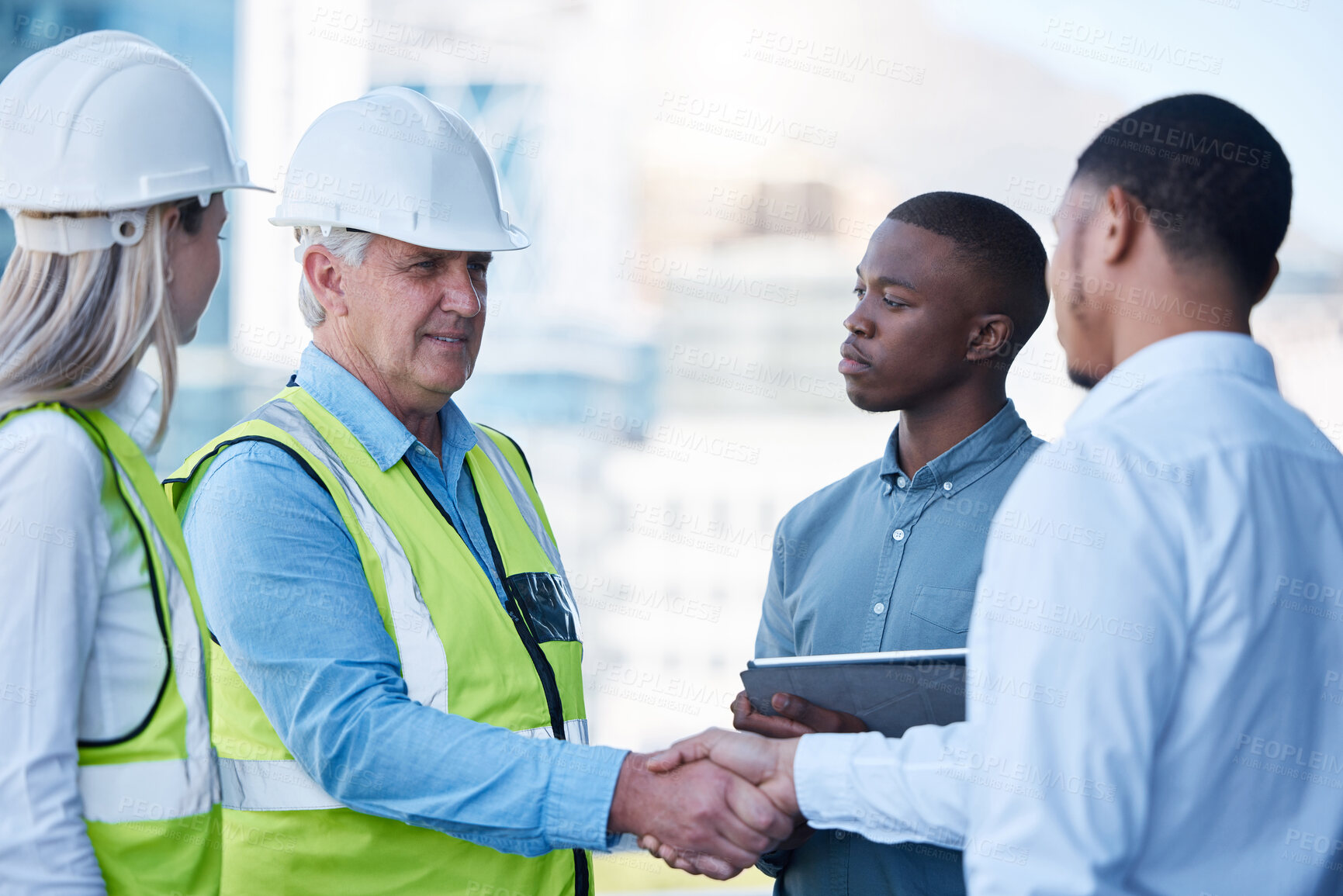 Buy stock photo Building, handshake and men in deal for architecture, planning and agreement at construction site. Project, collaboration and civil engineering team shaking hands for urban development with welcome