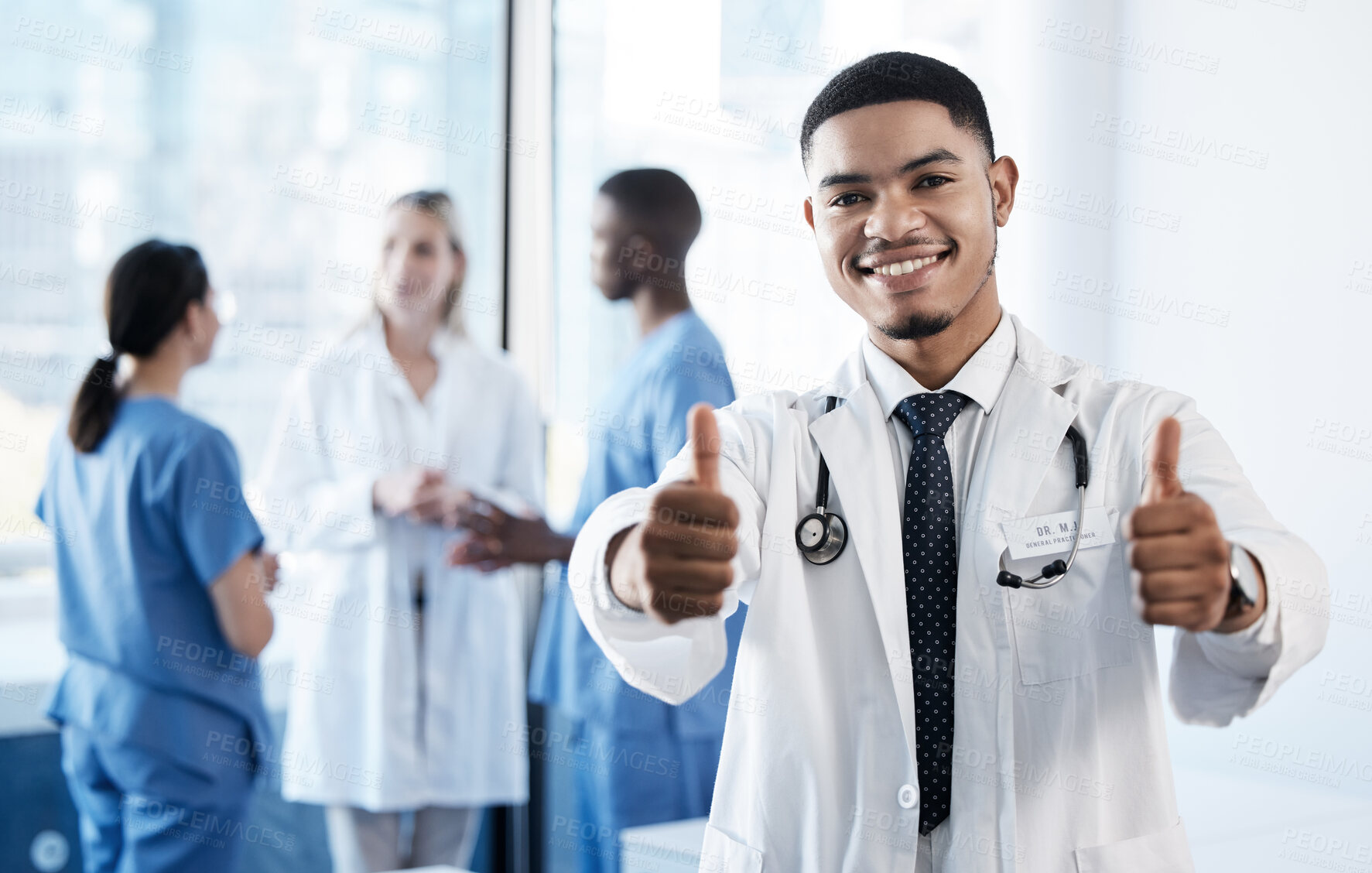 Buy stock photo Doctor, man and thumbs up in portrait at hospital for agreement, choice or good news for wellness. Medic, person and happy with emoji, like or sign for vote with healthcare services by team in clinic