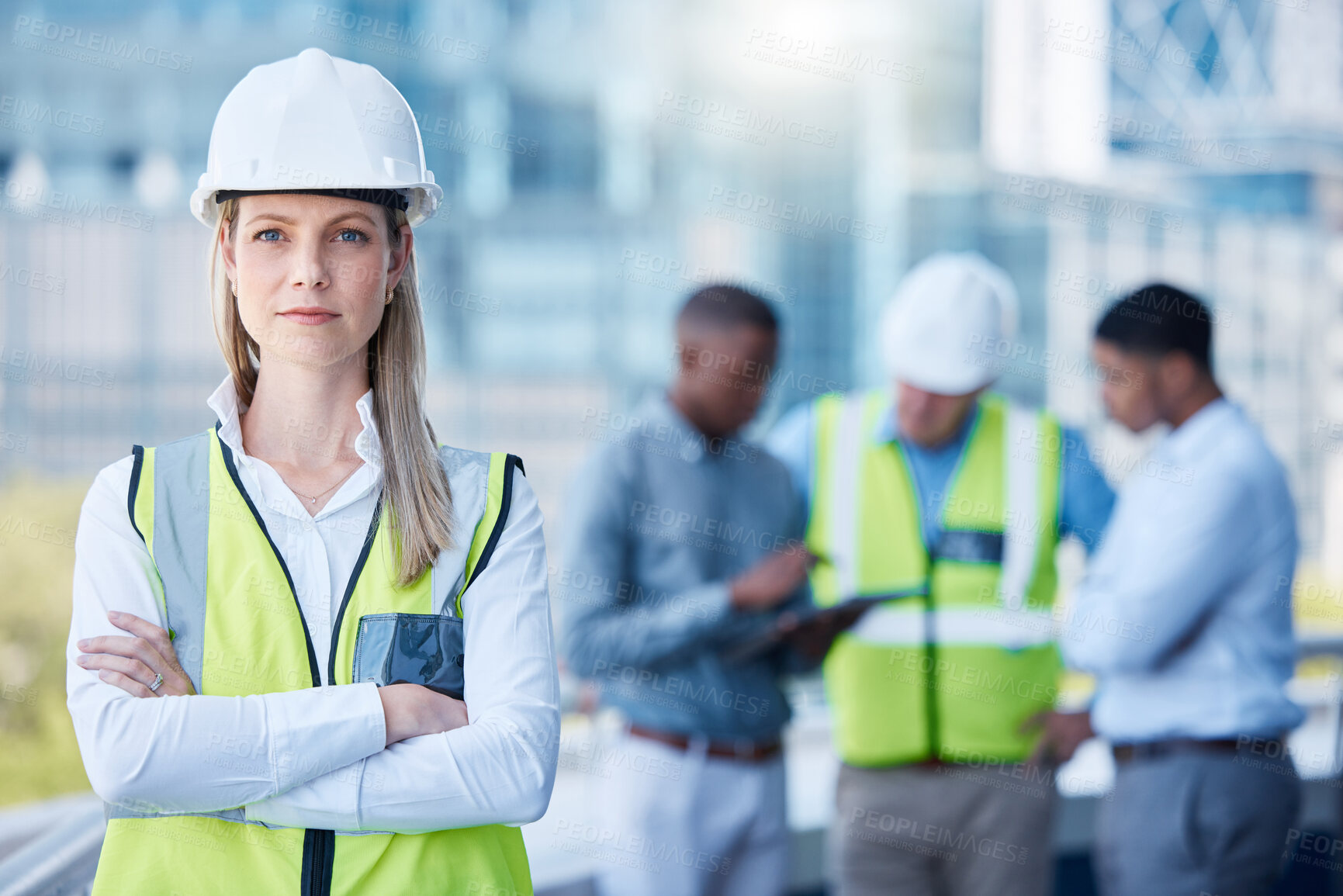 Buy stock photo Portrait, arms crossed and a serious woman construction worker outdoor on a building site with her team in the background. Management, leadership and a confident female architect standing outside