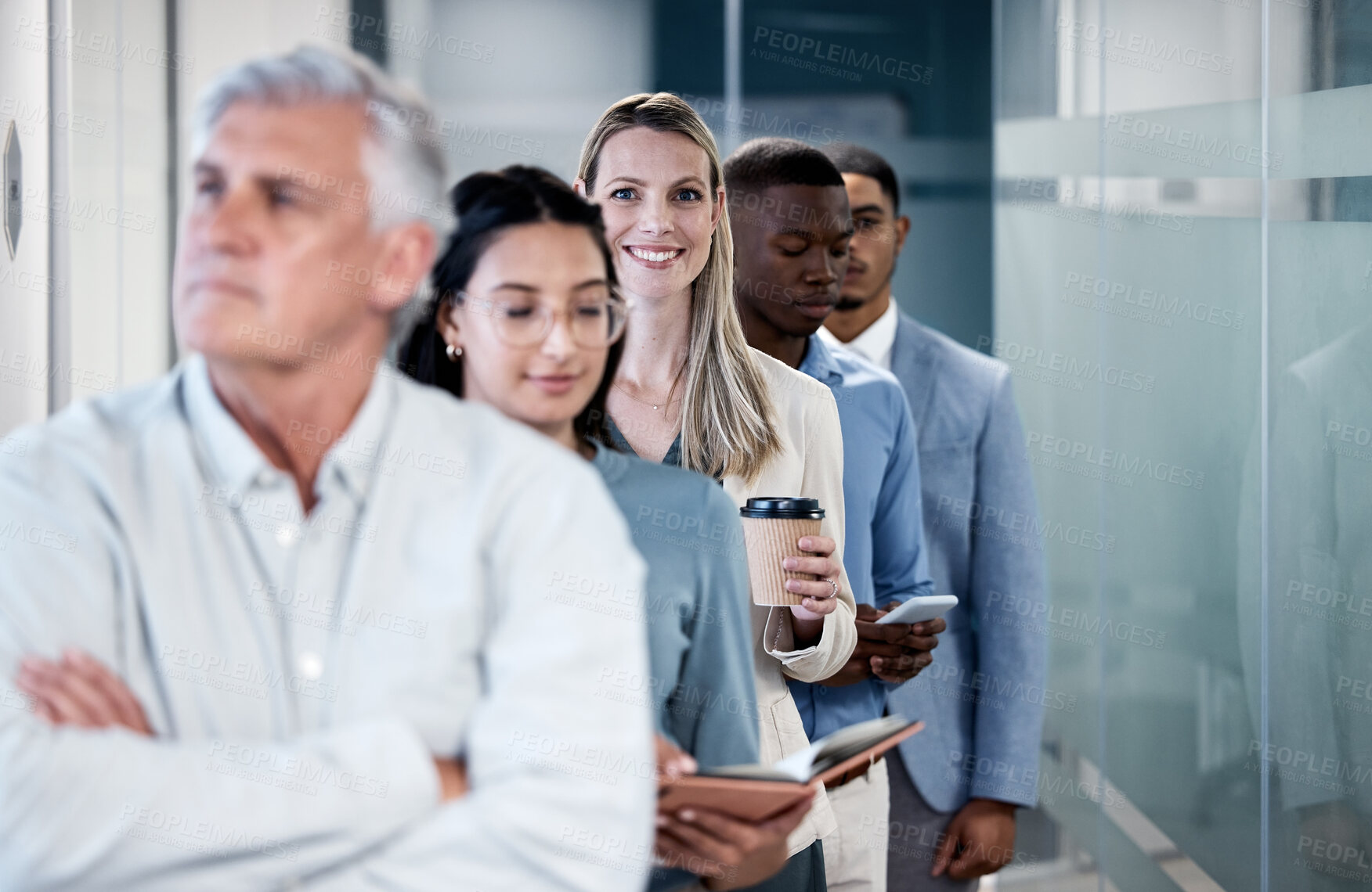 Buy stock photo Woman, portrait and smile in queue for interview, recruitment and opportunity for job in hallway. Person, group and line for offer, onboarding and hiring with coffee, happy or career in modern office