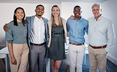 Buy stock photo Portrait of a group of confident businesspeople standing together in an office