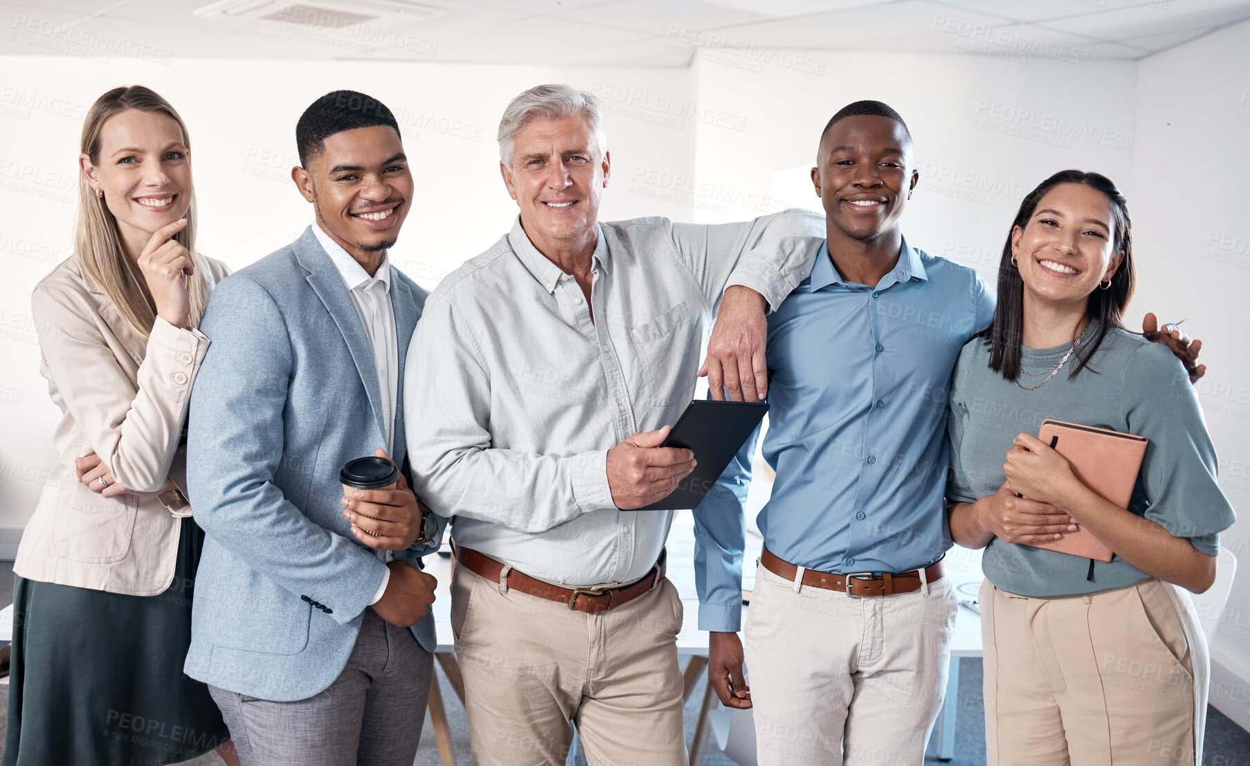 Buy stock photo Portrait of a group of confident businesspeople standing together in an office