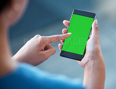 Buy stock photo Shot of an unrecognisable doctor using a smartphone with a green screen on it