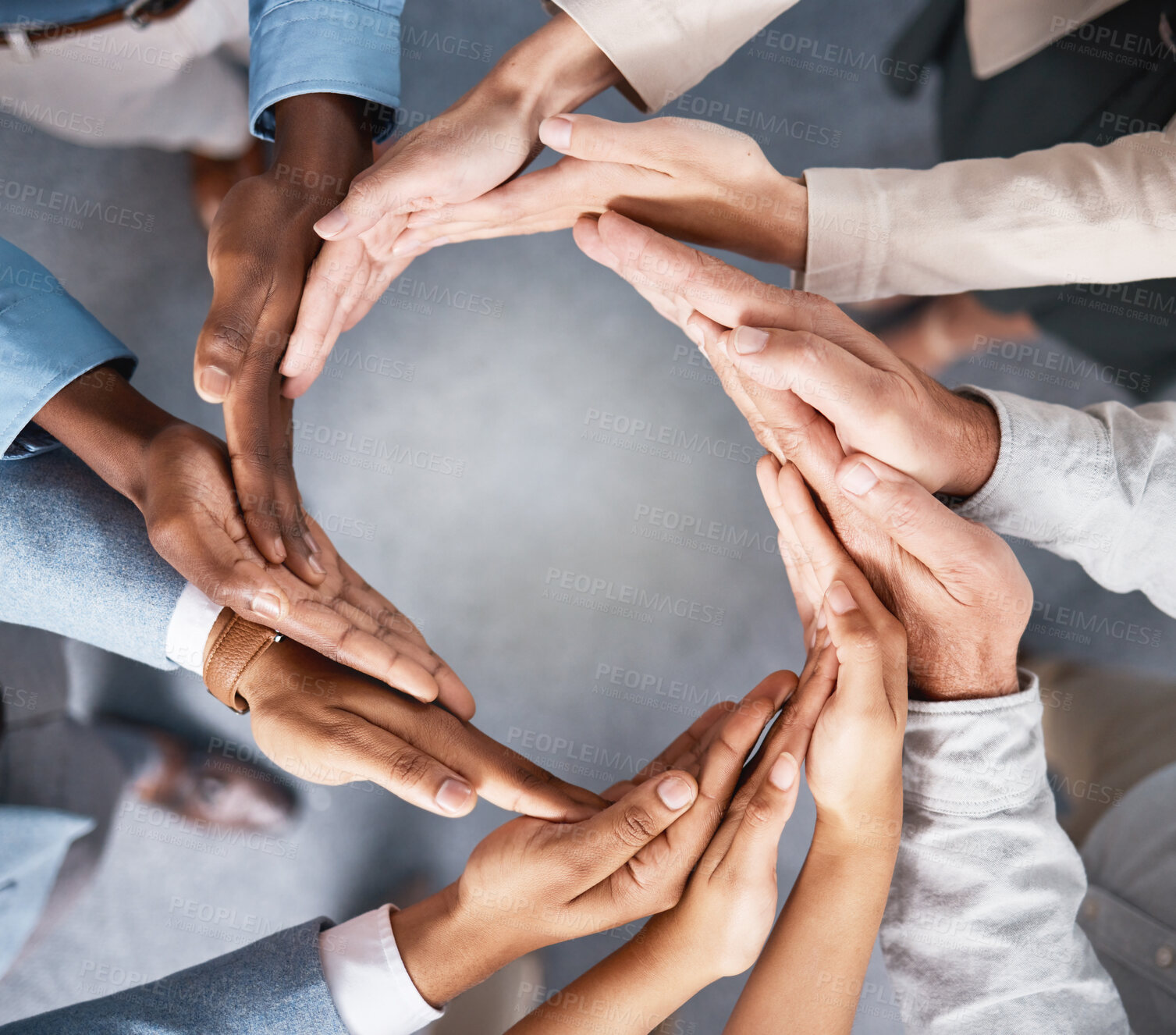 Buy stock photo Shot of a group of businesspeople joining hands in solidarity