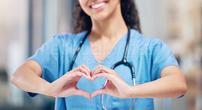 Buy stock photo Happy woman, doctor and heart hands for love in healthcare or life insurance at the hospital. Female person or medical professional showing hand loving emoji, symbol or sign gesture at the clinic