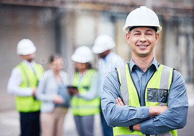 Buy stock photo Shot of a mature male architect standing with his arms crossed at a building site