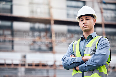 Buy stock photo Shot of a mature male architect standing with his arms crossed at a building site