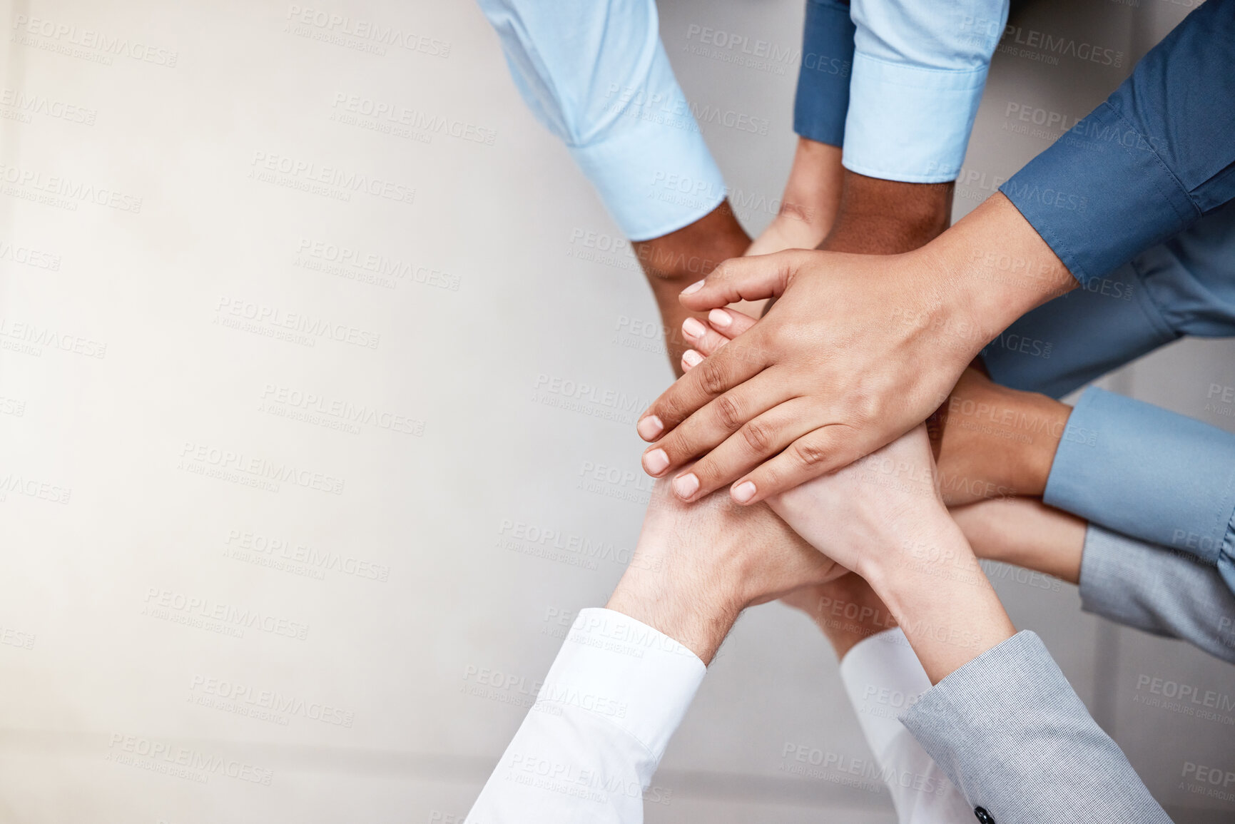 Buy stock photo Hands, mockup and business people in a huddle from above for support, motivation or solidarity. Collaboration, teamwork and space with a group of colleagues or employees standing in a circle at work