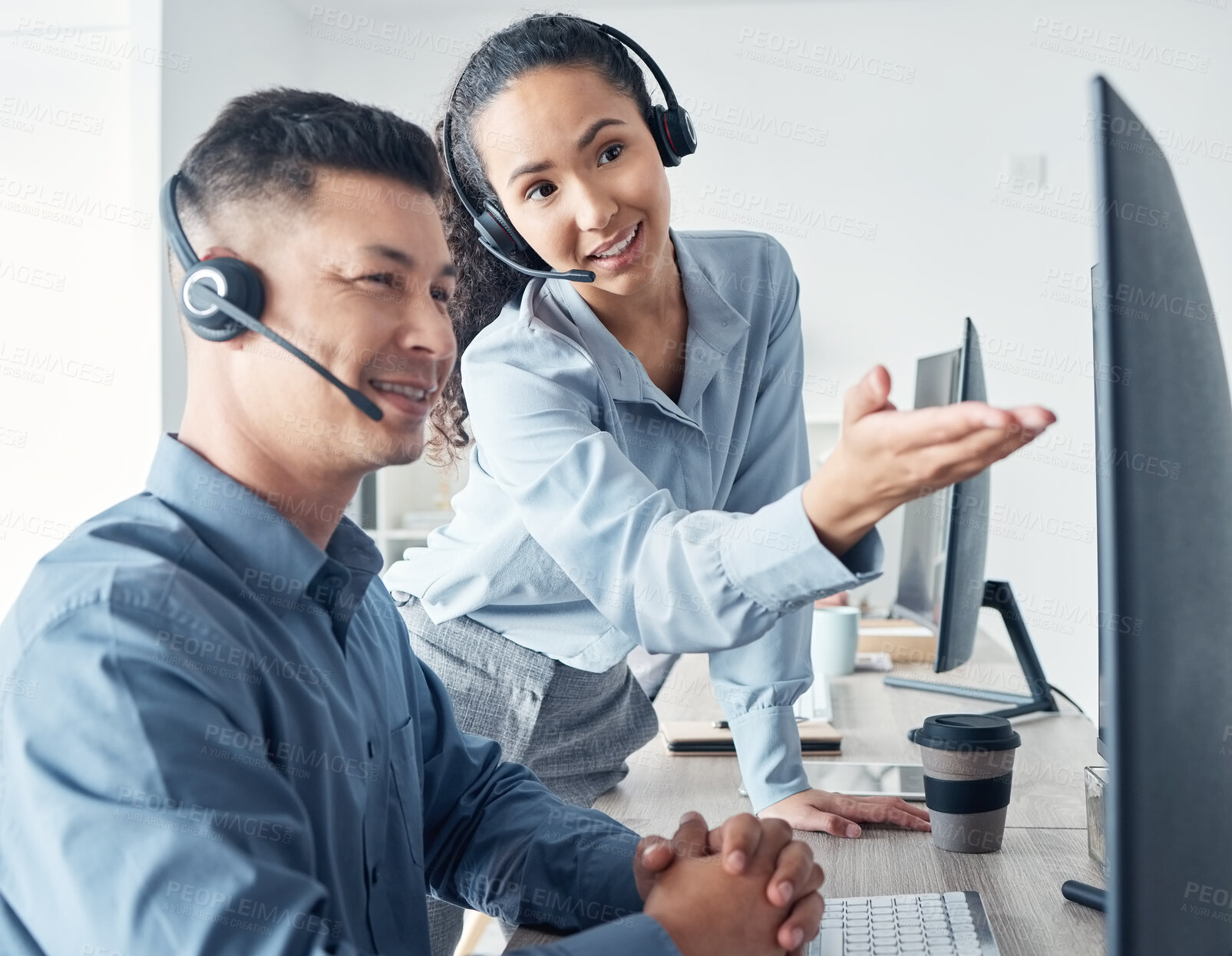 Buy stock photo Pointing, headset and people with smile, computer and woman with help for man, online and conversation. Desk, customer service and research for question, inquiry and call center and telemarketing