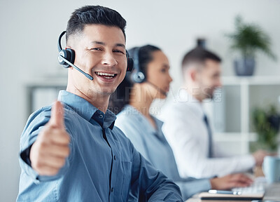 Buy stock photo Man at callcenter, thumbs up in portrait and CRM, communication of support and agreement emoji. Contact us, customer service and tech, male agent with headset and smile, success and yes hand gesture