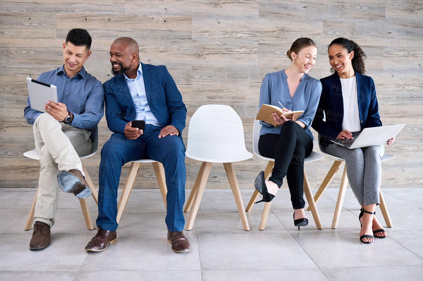 Buy stock photo Recruitment, chair and row of people with interview, discussion and notes in book, laptop or tablet. Hiring, diversity and candidate group ready with smile, work opportunity and queue for vacancy