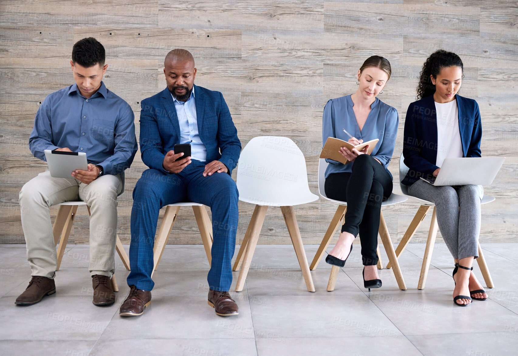 Buy stock photo Recruitment, chair and queue of people with interview, discussion and notes in book, laptop or tablet. Hiring, diversity and candidate group ready with smile, work opportunity and row for vacancy