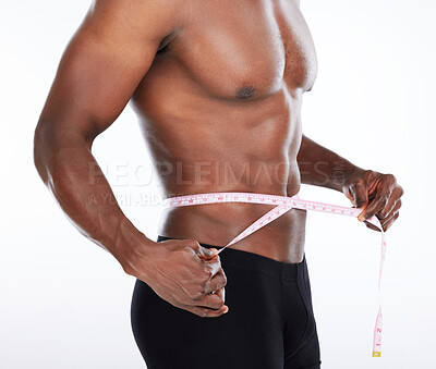 Buy stock photo Check, abs or hands of man with tape measure for body progress, waist or workout in studio. Muscle, fitness or athlete with stomach, results or six pack in training to lose weight on white background