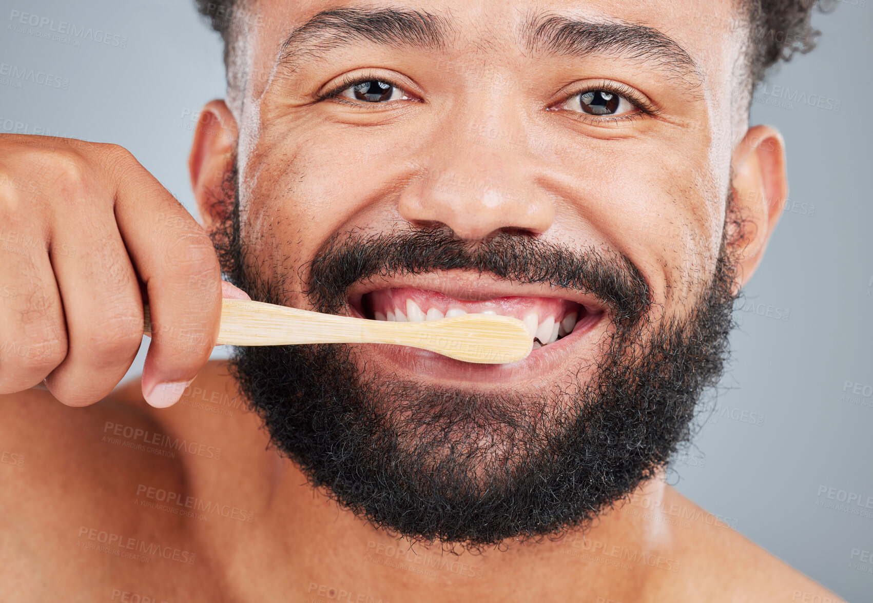 Buy stock photo Man, portrait and brushing teeth with toothbrush on studio background for dental care, plaque removal and fresh breath for mouth. Person, closeup and oral hygiene for wellness routine and white smile