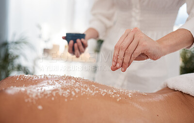 Buy stock photo Spa, hands and body with salt for skincare, exfoliation and wellness for skin massage with relax. Beauty salon, person and masseuse for customer service, hospitality and scrub for retreat therapy