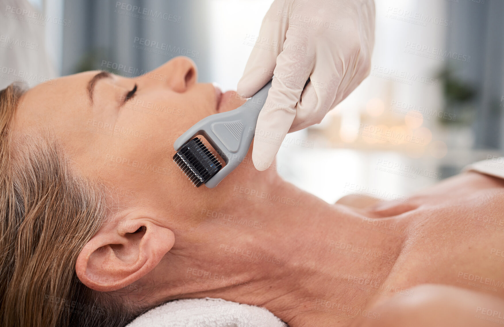 Buy stock photo Spa, relax and woman with derma roller for skincare, facial and mesotherapy treatment for anti aging benefits. Cosmetics, dermatology and client at beauty salon for microneedling skin process on face