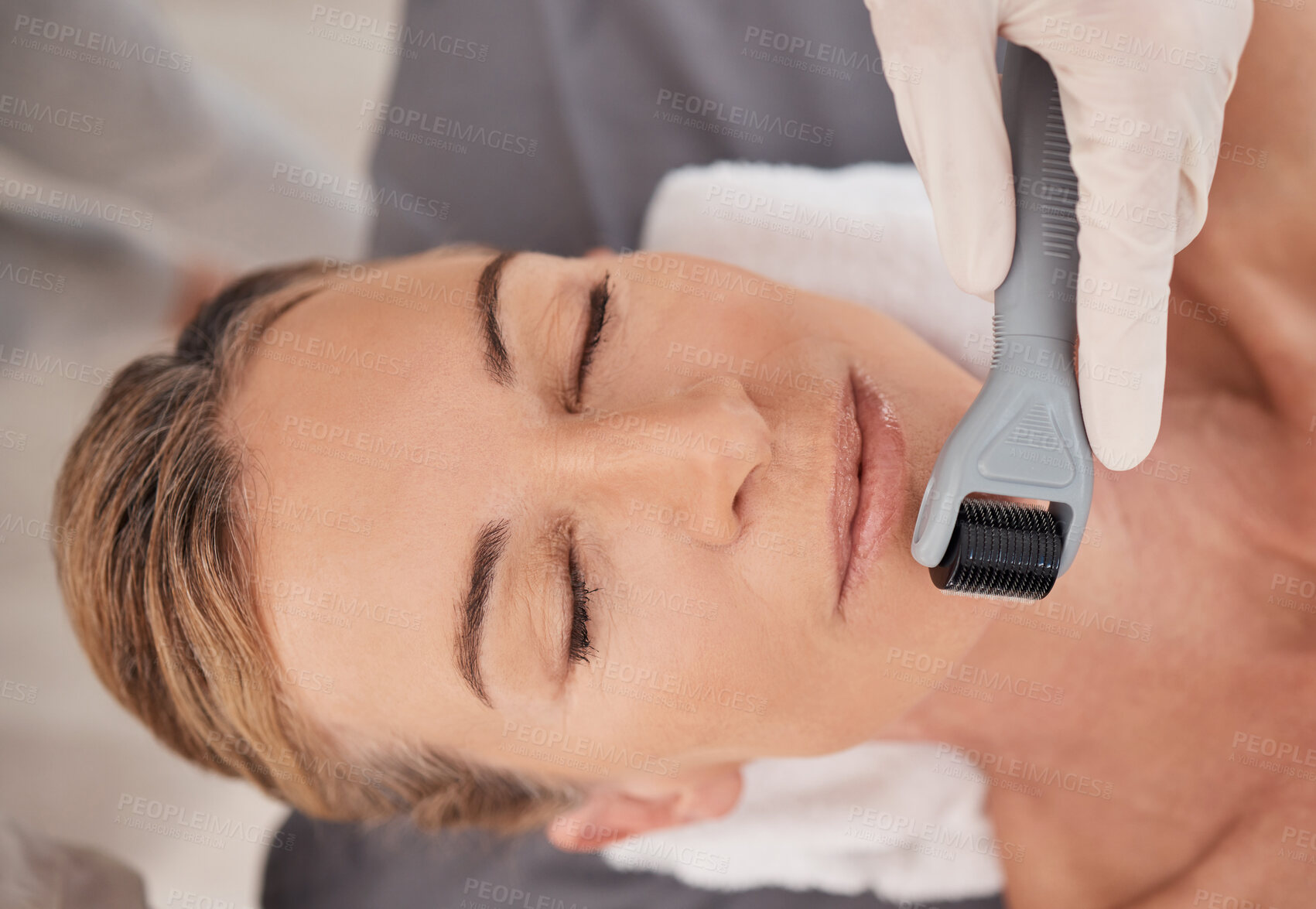 Buy stock photo Spa, relax and woman with derma roller for mesotherapy, skincare and facial treatment for anti aging benefits. Cosmetics, dermatology and client at beauty salon for microneedling skin process on face