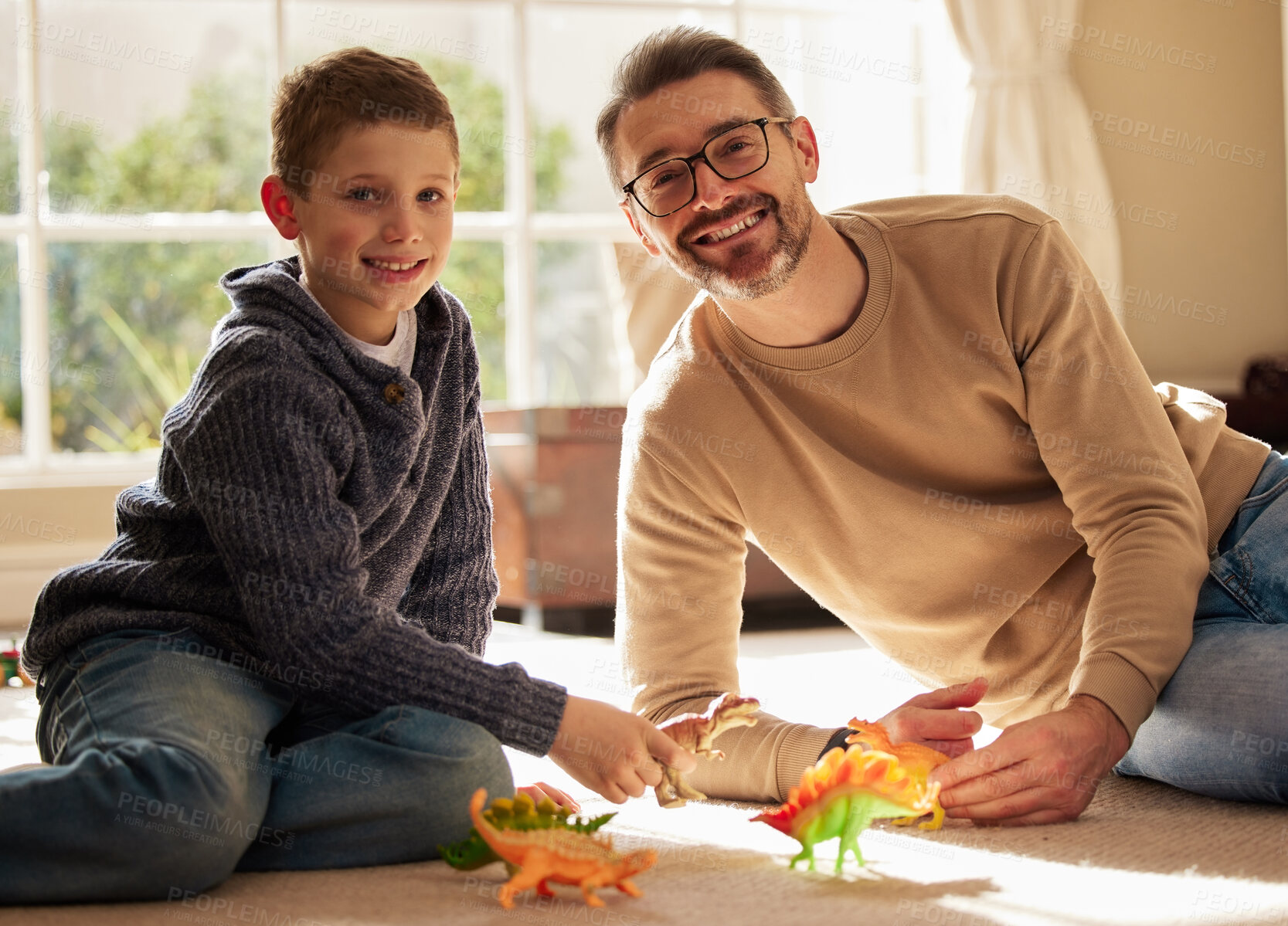 Buy stock photo Father, son and portrait with toys at house for plastic dinosaur, learning and fantasy games of education. Smile, family and reptile animal of creative development, bonding together and childhood fun