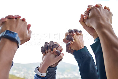 Buy stock photo Closeup shot of a group of unrecognisable people holding hands while exercising outdoors