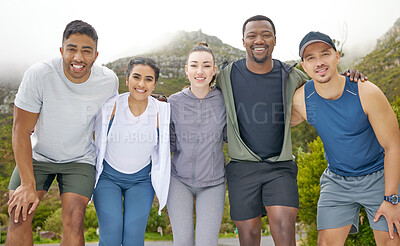 Buy stock photo Portrait of a group of sporty young people standing together in a huddle while exercising outdoors